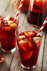 Glasses of sangria on grey wooden background