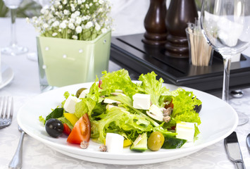 Greek salad on a table in a restaurant