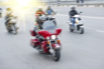 Blured motorcycle racer - 83879129