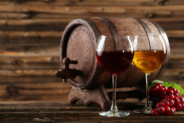 Red and white wine glass with bottle and barrel 