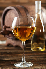 White wine glass with bottle and barrel 