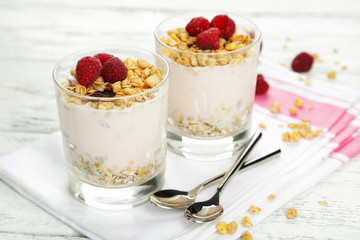 Muesli with yogurt and raspberries in a glass 