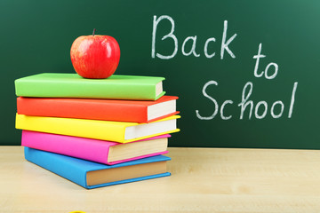 Books and blackboard. Back to school.