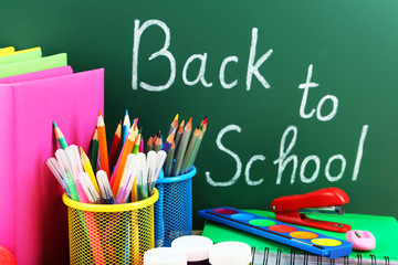 Back to school supplies. Books and blackboard.