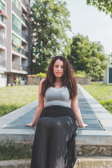 Beautiful curvy girl posing in an urban context