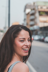 Beautiful curvy girl posing in an urban context