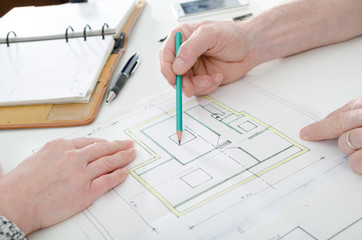 Architect showing house plans