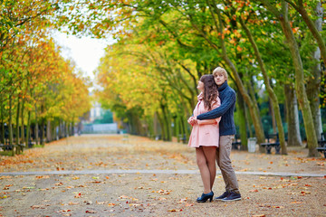 Young dating couple in Paris on a bright fall day