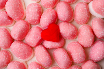 Pink jellies or marshmallows as background