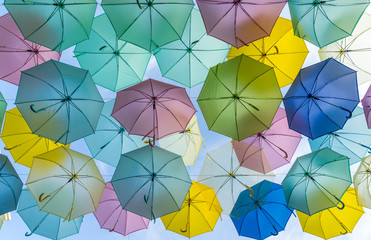 Pastel Umbrellas hanged on a lines