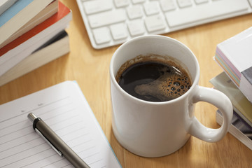 pen with notebook on working table