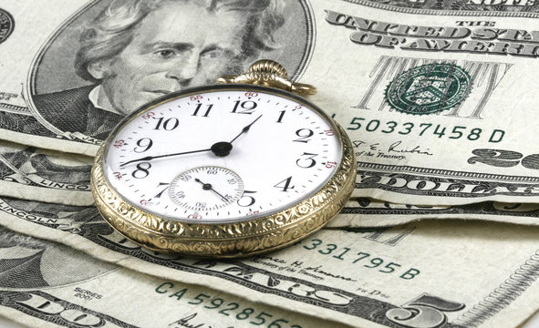 Time and Money concept image with watch and cash