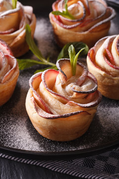healthy food: apple pie in the form of roses macro. Vertical
