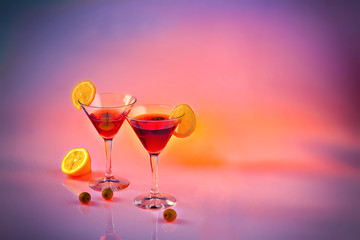 Two martinis on pink background