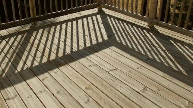 Time Lapse Shadows Moving Across Wooden Deck in Back Yard