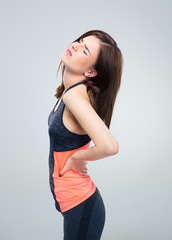 Fitness woman having back pain