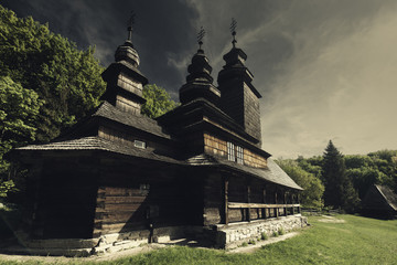 Fototapeta premium Dramatic landscape with orthodox church under mood skies