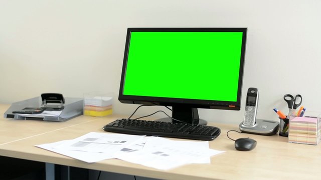 desktop computer in the office - green screen - nobody (empty)