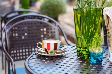 Coffee cup on table in cafe