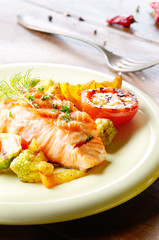 Fried salmon fillet with vegetables