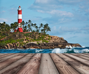 Wood planks floor with old lighthouse and waves of  sea © Dmitry Rukhlenko