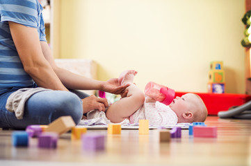 Young father with his cute baby daughter inside