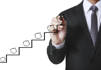 Businessman drawing piggy bank