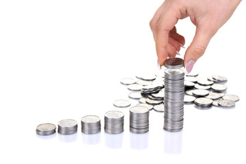 Hand put coins to stack of coins