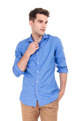  young man holding one hand in his pocket