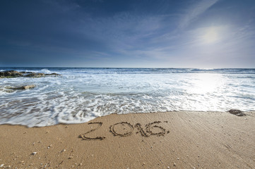 2016 written on sandy beach