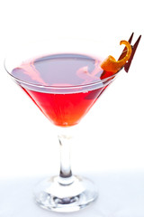cosmopolitan cocktail garnished with a orange rind