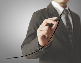 Businessman drawing graphics