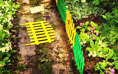 beautiful part of the floral garden with decorative fence
