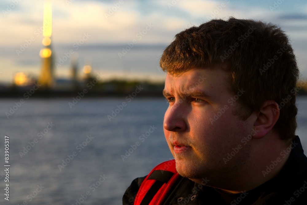 Wall mural handsome young man tourist making his trip at saint petersburg