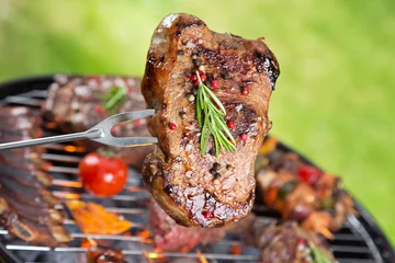 Garden poster Grill / Barbecue Beef steak on garden grill