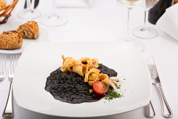 Black Risotto and Fried Calamari in restaurant