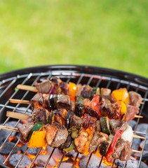 Delicious skewers on garden grill
