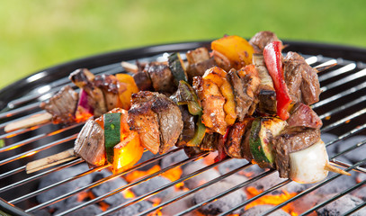 Delicious skewers on garden grill