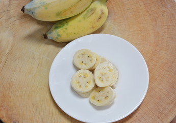 cultivated banana slice on chop block
