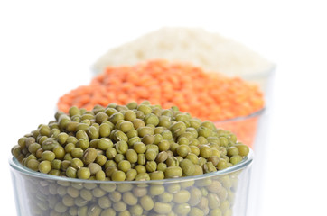 full glasses with mung, lentil and chick-pea isolated on white