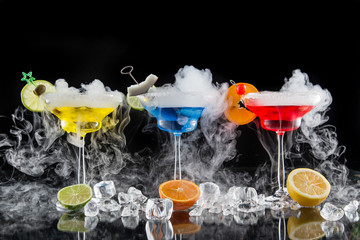 Cocktail with ice vapor on bar desk