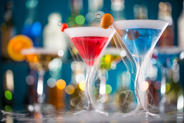 Cocktail with ice vapor on bar desk