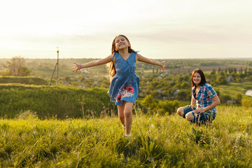 Little girl running on meadow