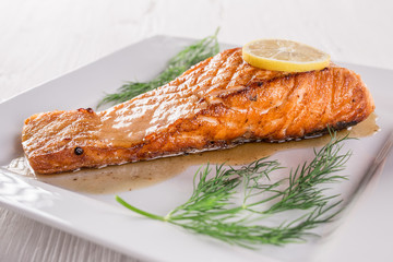 Salmon steak on white plate