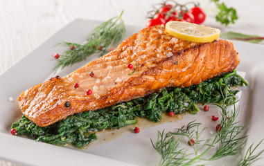 Salmon steak on white plate