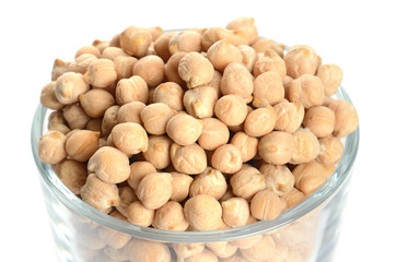 full glass of chick peas isolated on white