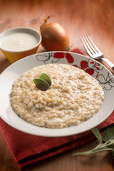 risotto with onion  cream sauce and sage, selective focus