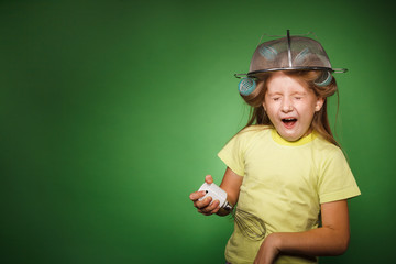 Little girl housewife with kitchenware play music