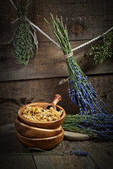 Naklejka premium Herbs drying on the wooden table