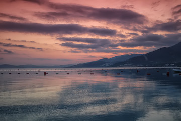 there is a horizon with filtered sea, sky and mountain